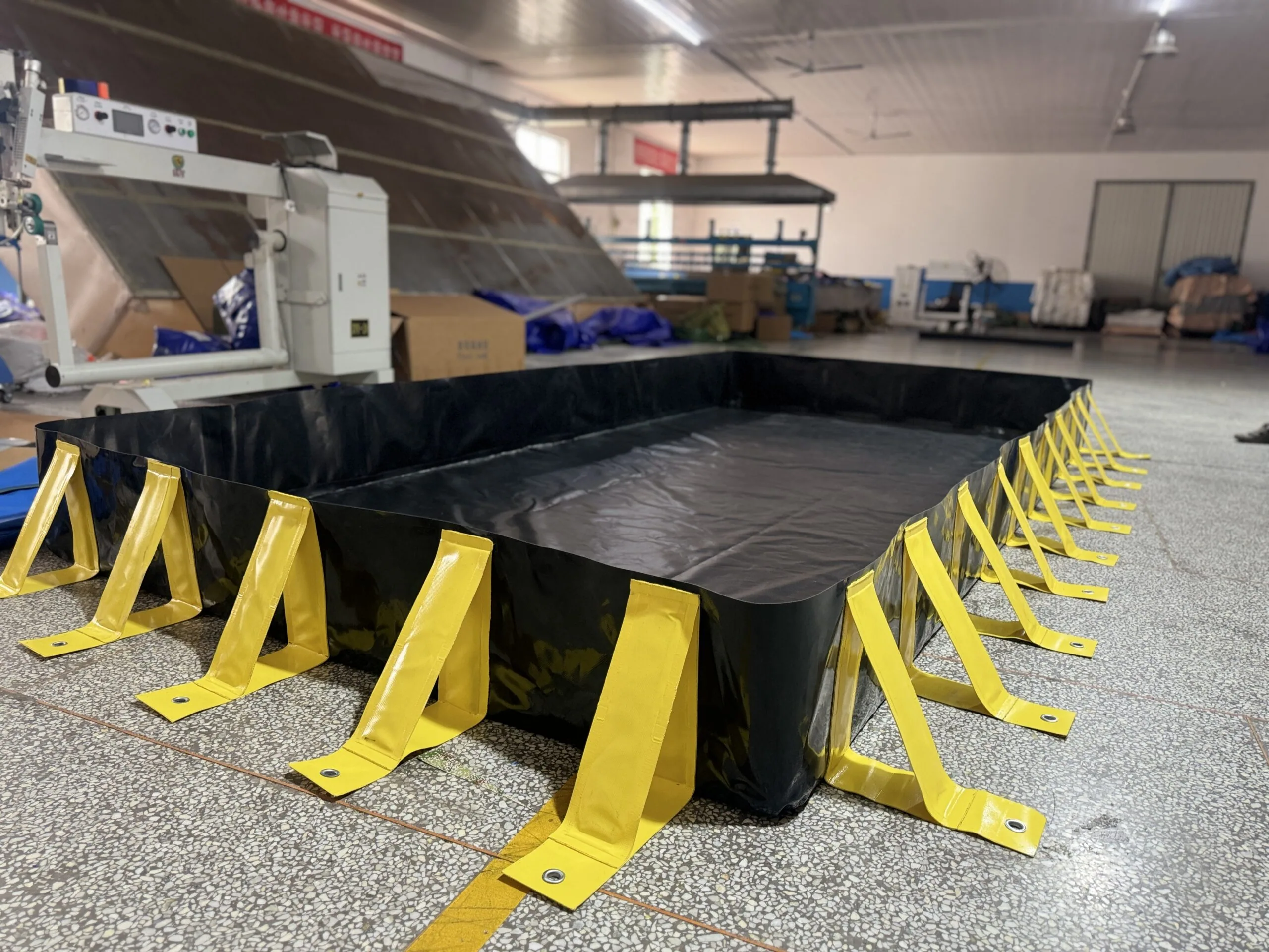 Spill containment berm with external supports for added wall stability