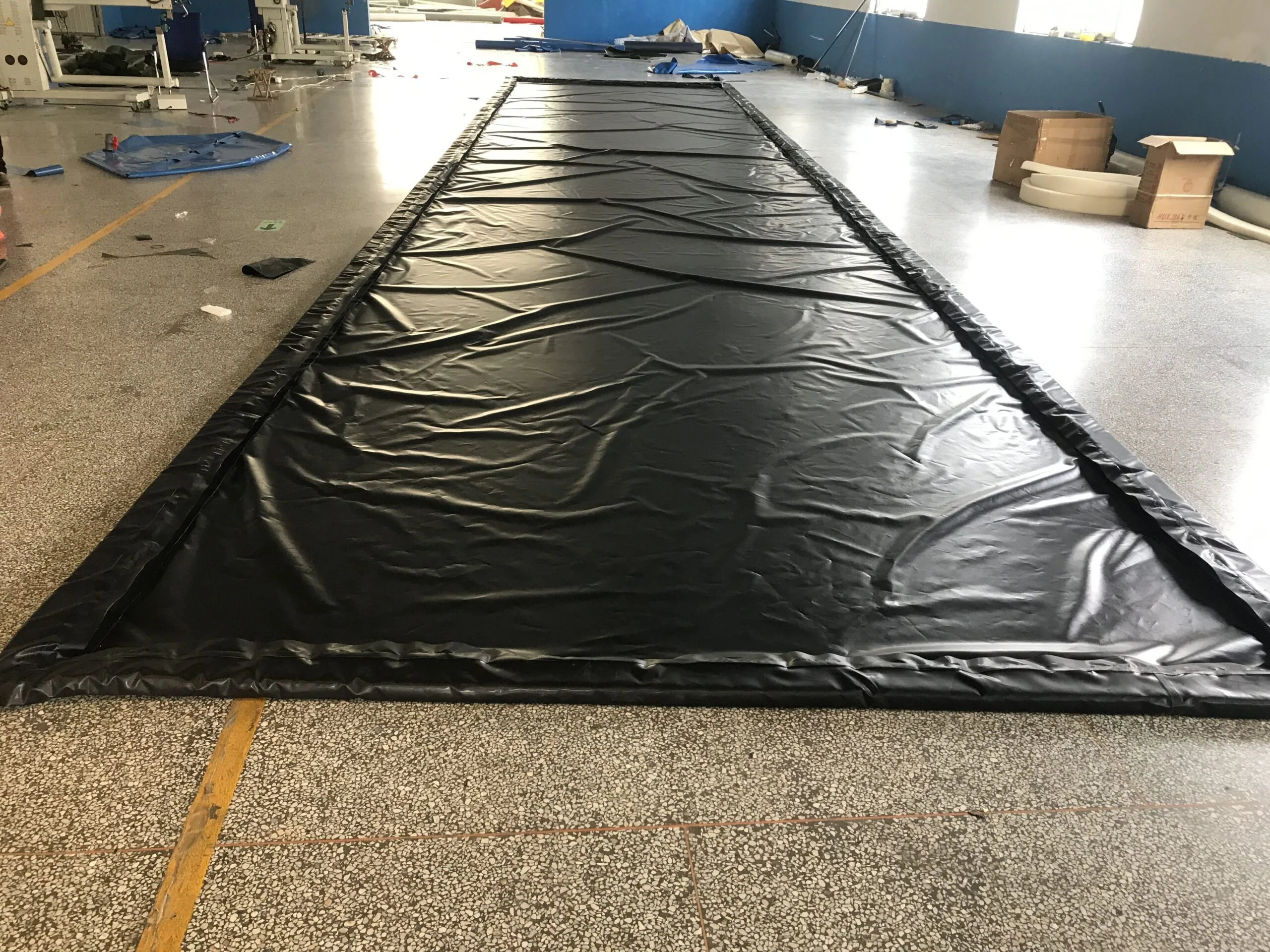 Sponge-filled wall spill containment berm, lightweight flexible-wall design