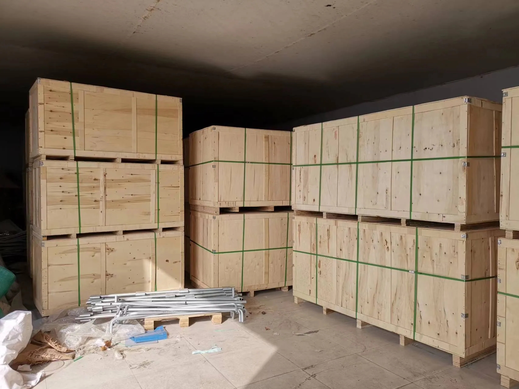 Export crates strapped and staged for shipment in the FUUSHAN warehouse