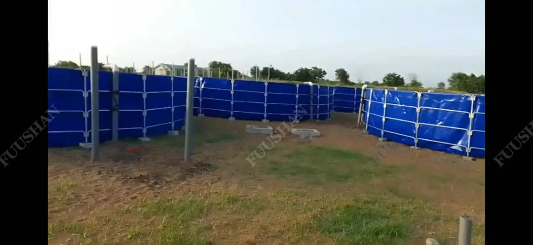 Blue tank structure and galvanized support posts during on-site assembly