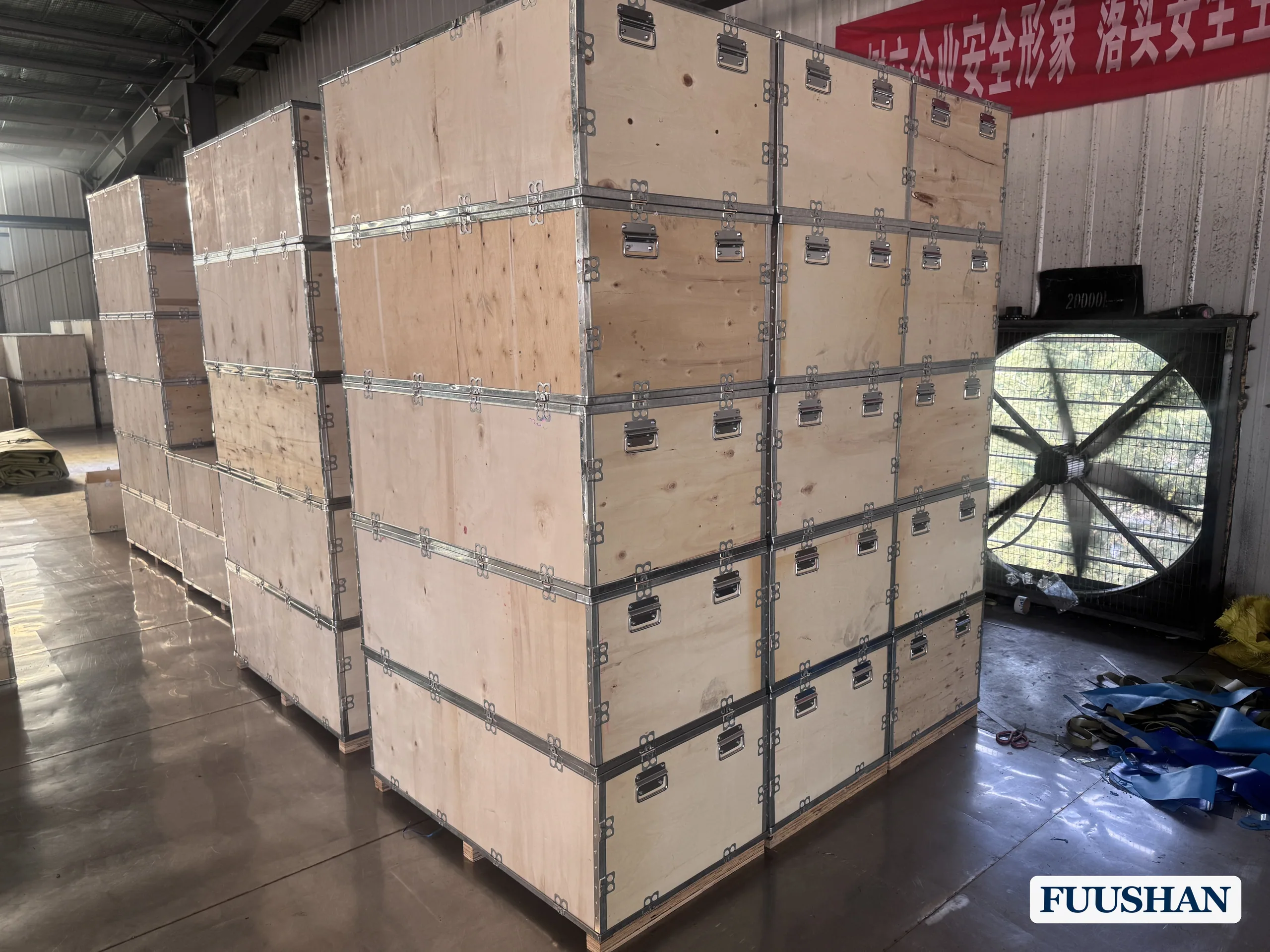 Flexible water bladders packed in wooden crates in the FUUSHAN warehouse before export