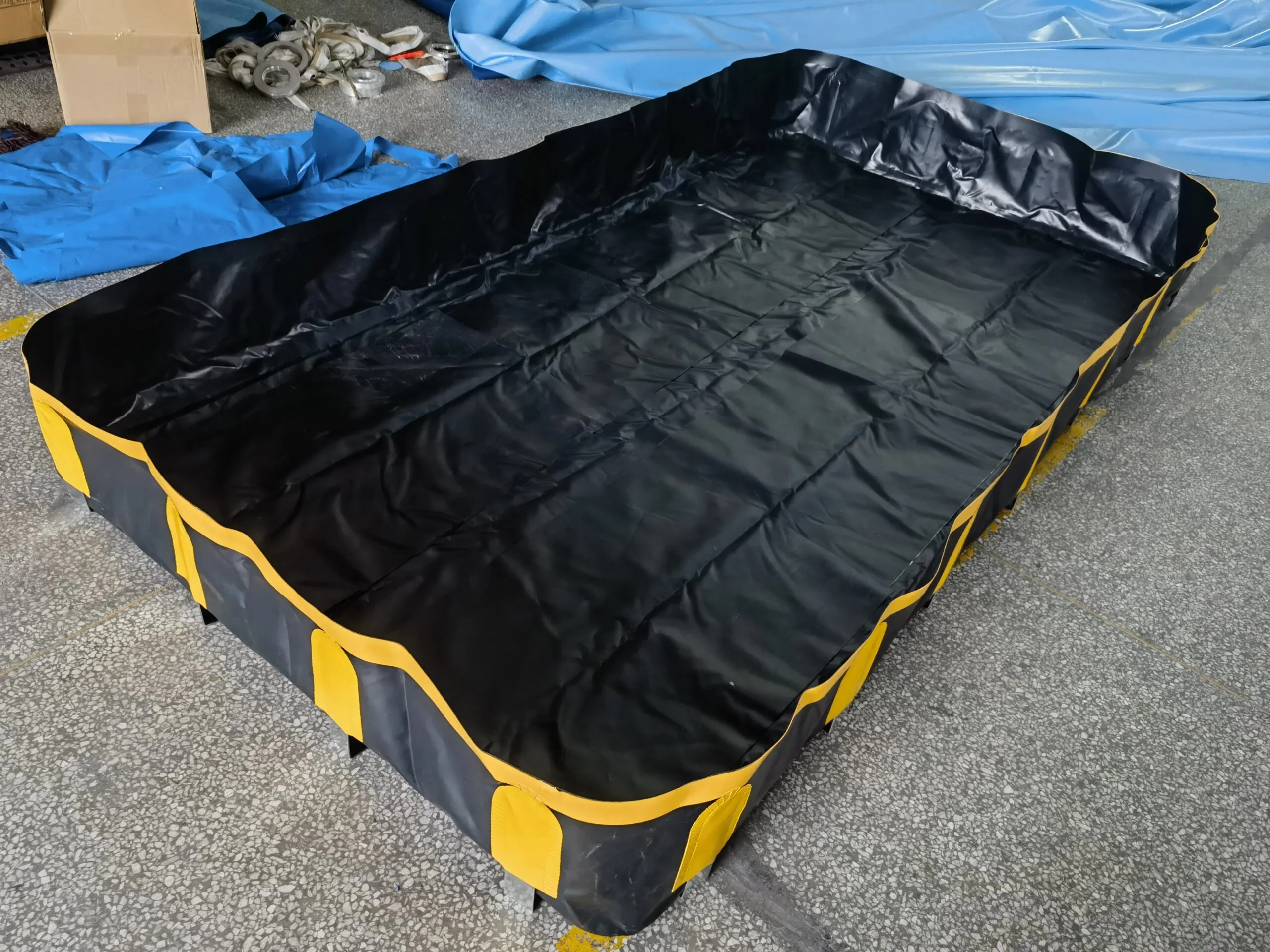 Portable spill containment berm deployed on site