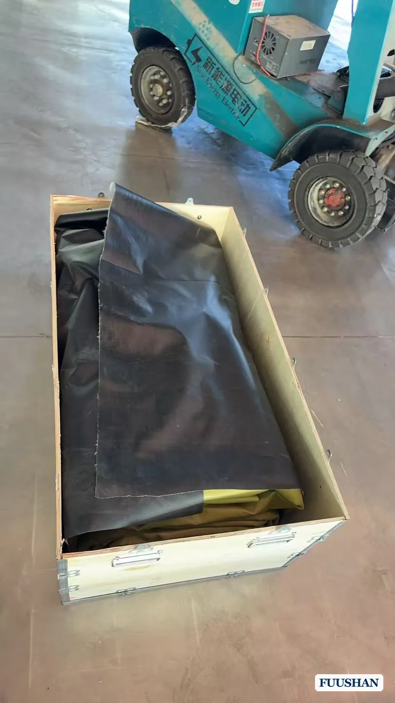Flexible water bladder liner laid inside an open wooden export crate during packing