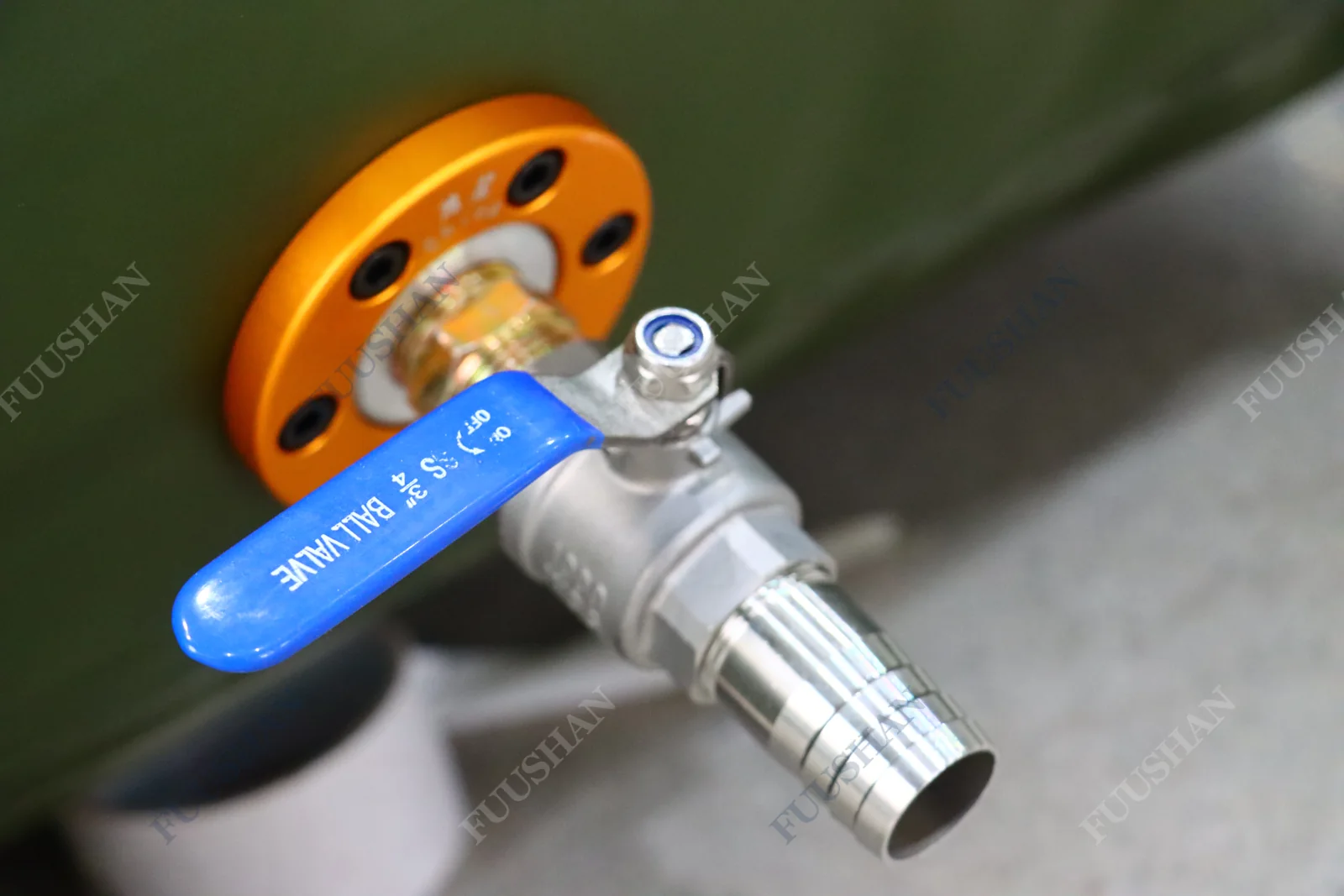 Blue-handled ball valve and hose-tail outlet on a circular flange