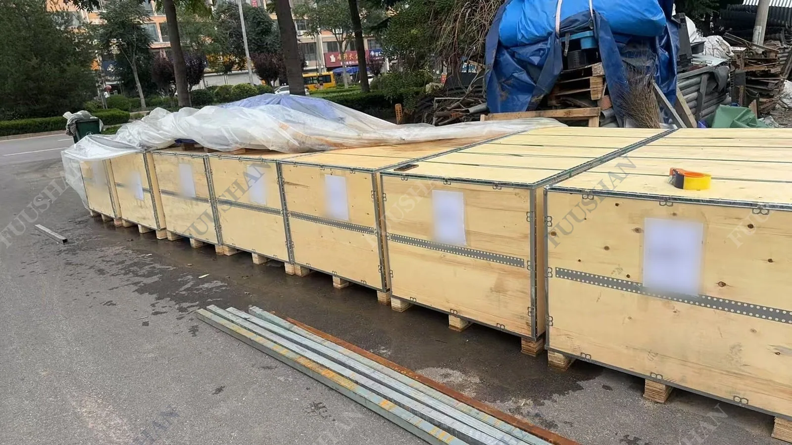 Row of wooden export crates on pallets outside