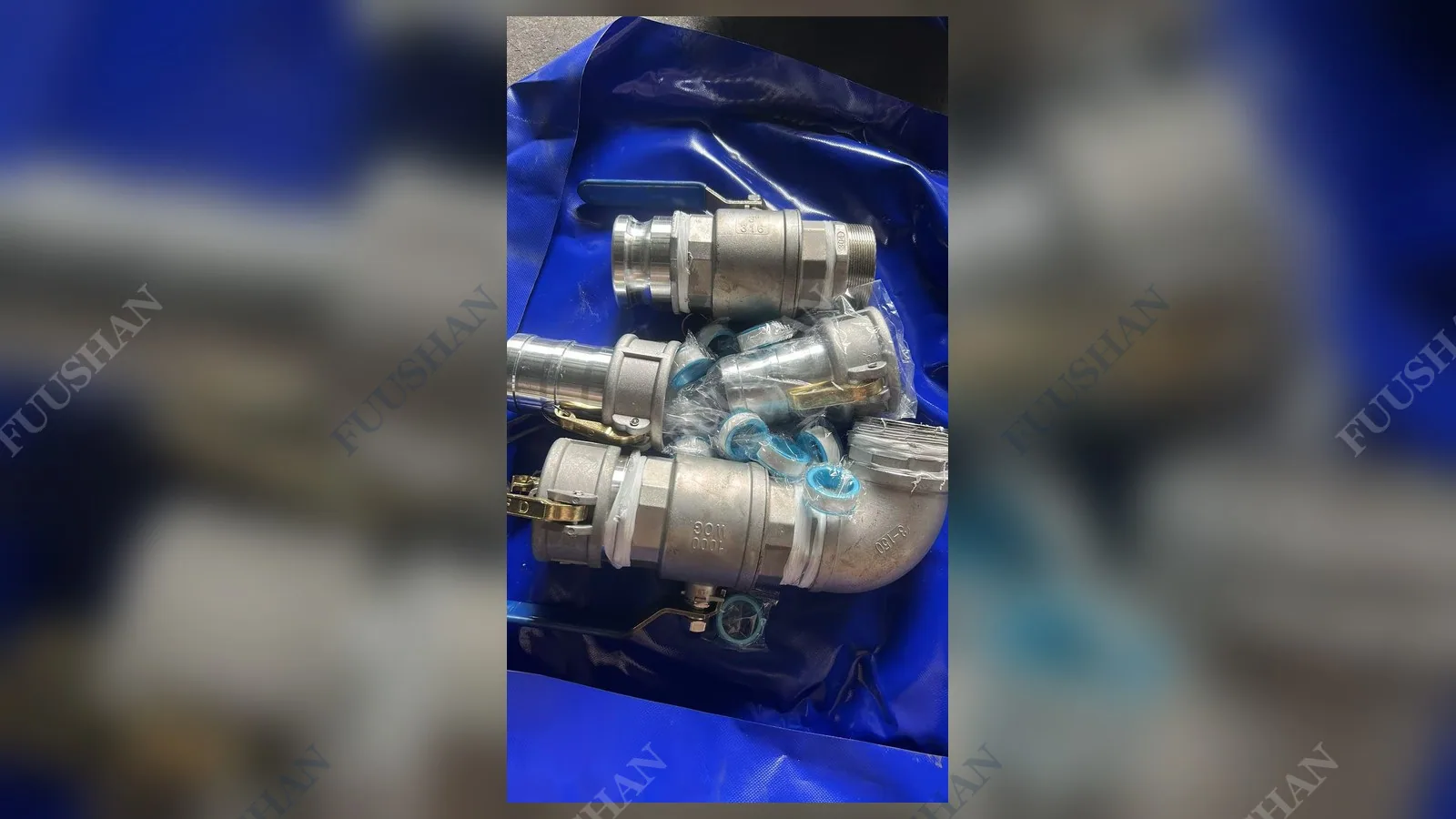 Ball valve and camlock fittings packed in a blue container